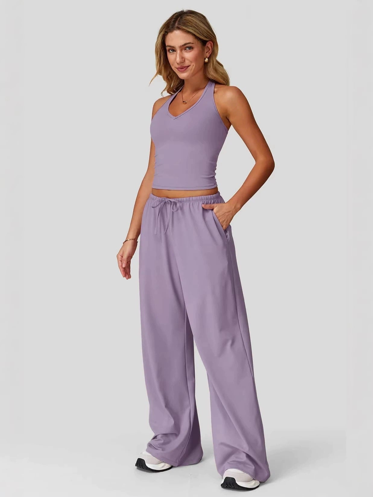 Women's sporty crop tank and wide-leg pants set in light purple, full outfit front view showing V-neck crop top and wide-leg silhouette