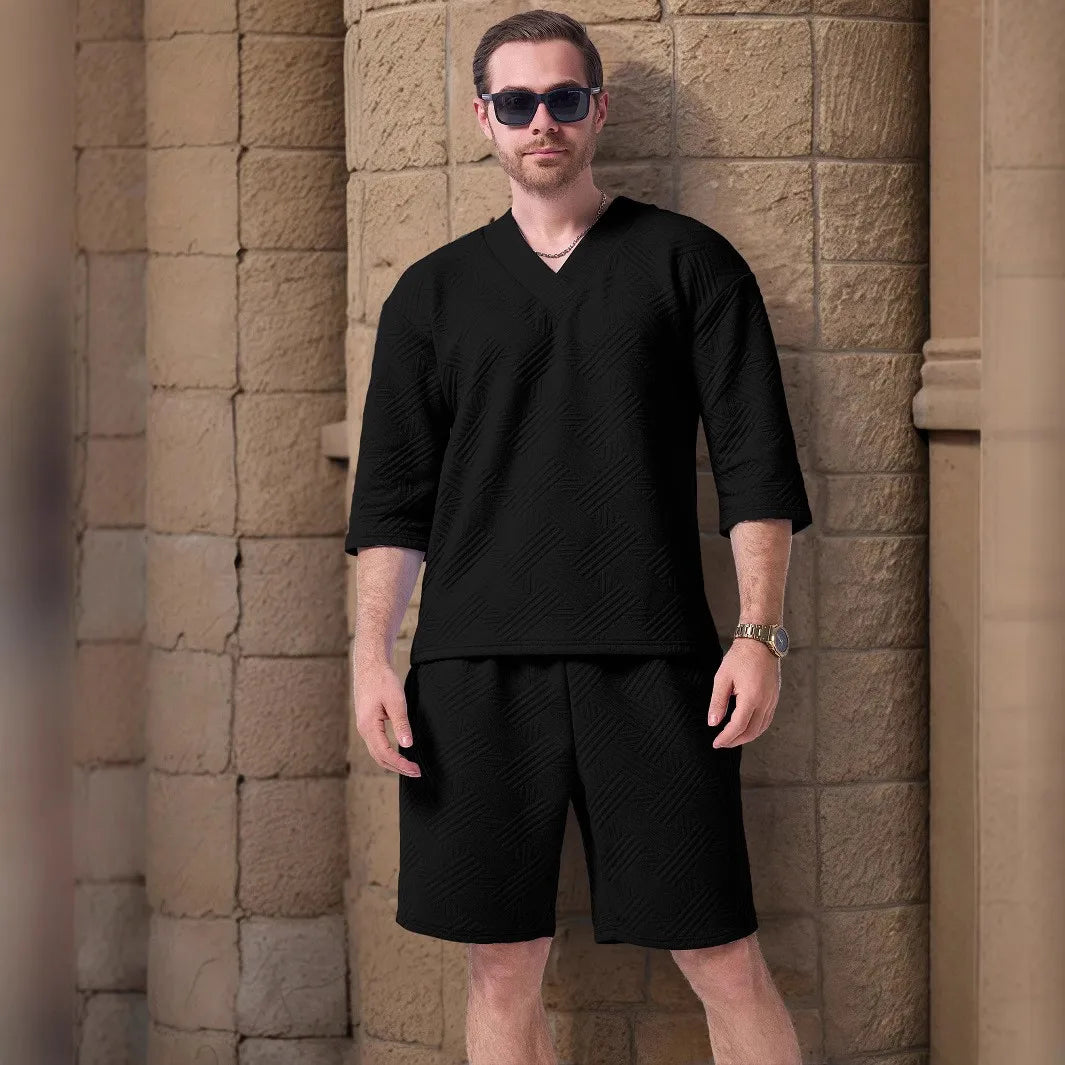 The 2025 new men's summer suit is a casual and versatile solid-color jacquard V-neck short-sleeved T-shirt with two shorts