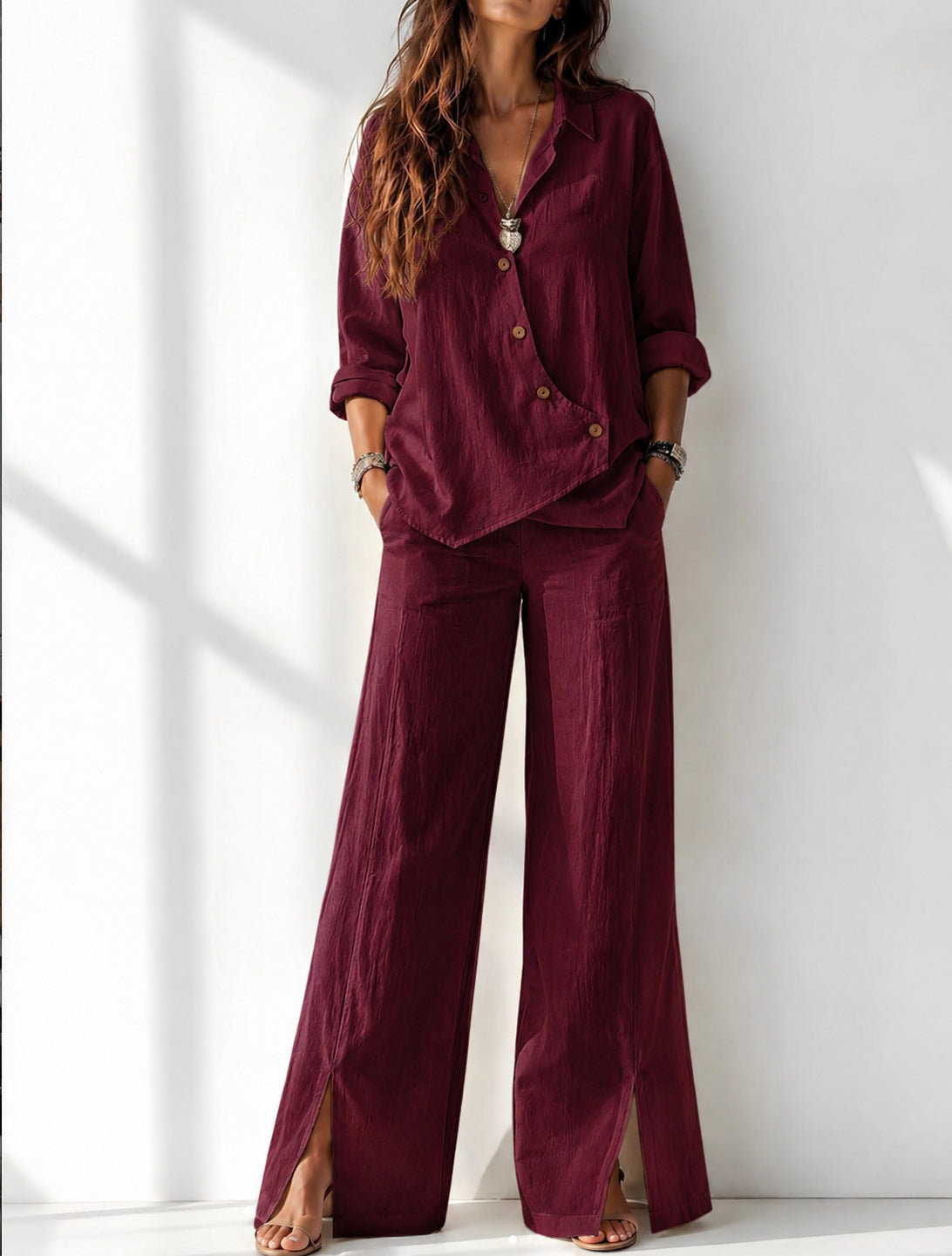 Women's asymmetrical long-sleeve top and wide-leg pants set in wine red – full outfit front view showing relaxed boho silhouette