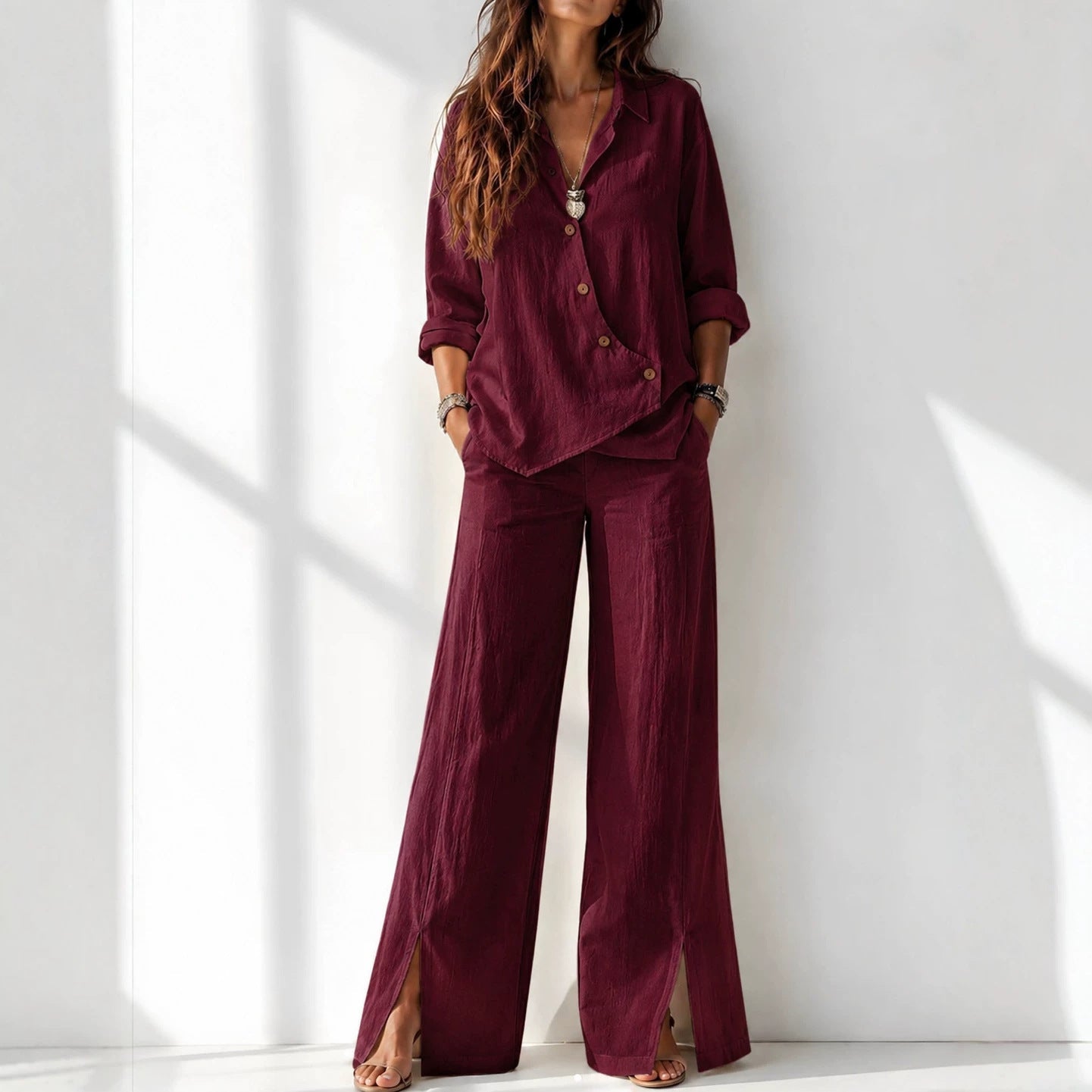 Women's asymmetrical long-sleeve top and wide-leg pants set in wine red – full outfit front view showing relaxed boho silhouette