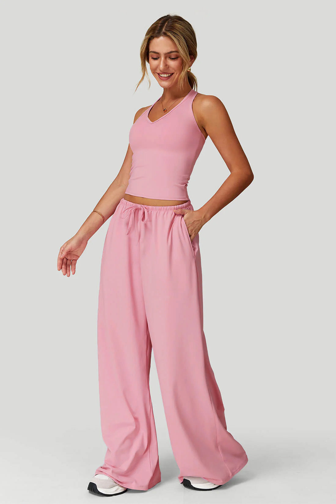 Women's sporty crop tank and wide-leg pants set, side view showing relaxed silhouette