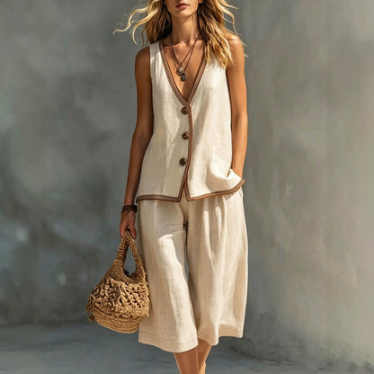 Women's beige sleeveless buttoned vest and matching shorts two-piece set featuring contrast trim detailing, modeled with a woven handbag.