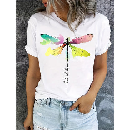 "Front view of a woman wearing the white short-sleeve t-shirt with light-wash denim shorts, showing the full upper-body fit and watercolor dragonfly graphic."