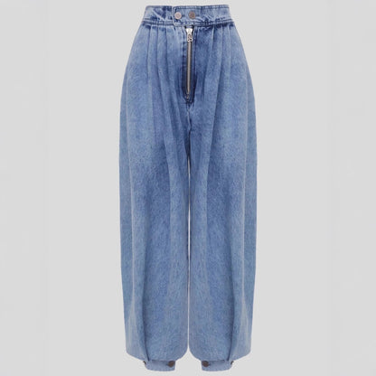 High-waisted light blue denim harem pants with an exposed front zipper, button waistband, pleated relaxed legs, and cinched ankle cuffs displayed against a light grey background.