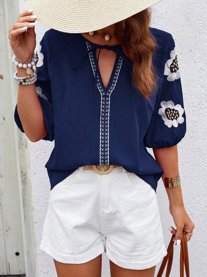Front view of the Navy Blue V-Neck Loose Long Sleeve Top with embroidered details.