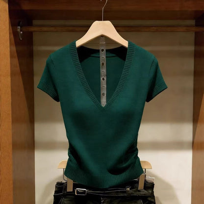 Women's green short-sleeve V-neck ice silk knit top featuring a slim-fit design, ribbed texture, and lightweight finish, hanging in a wooden wardrobe.