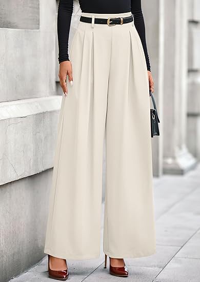Women's pleated cropped trousers in neutral beige featuring a slimming drape silhouette, structured front pleats, and an adjustable belted waist.