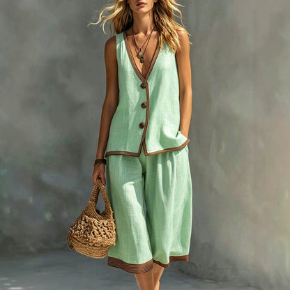 Women's light green sleeveless buttoned vest and matching cropped wide-leg pants two-piece set featuring contrast trim detailing, modeled outdoors with a woven handbag.