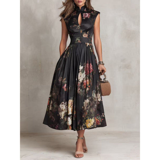 Women's black sleeveless maxi dress featuring a vibrant 3D floral print, mandarin collar, and keyhole neckline on a full-length A-line silhouette
