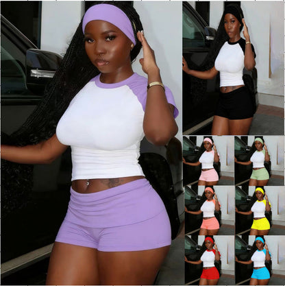 Women's purple raglan contrast color 3-piece sportswear set featuring a short-sleeve crop top, matching shorts, and a headband.
