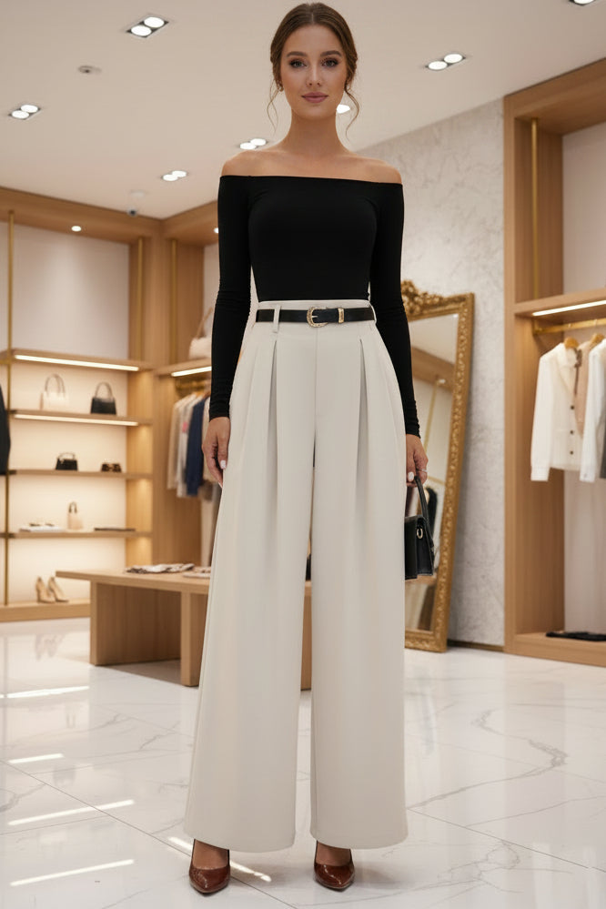 Women's pleated cropped pants in neutral beige featuring a slimming drape silhouette, adjustable waist, and structured pleats