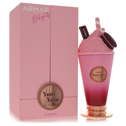 Armaf Yum Yum Eau de Parfum bottle styled like a pink milkshake next to its matching pink packaging box.