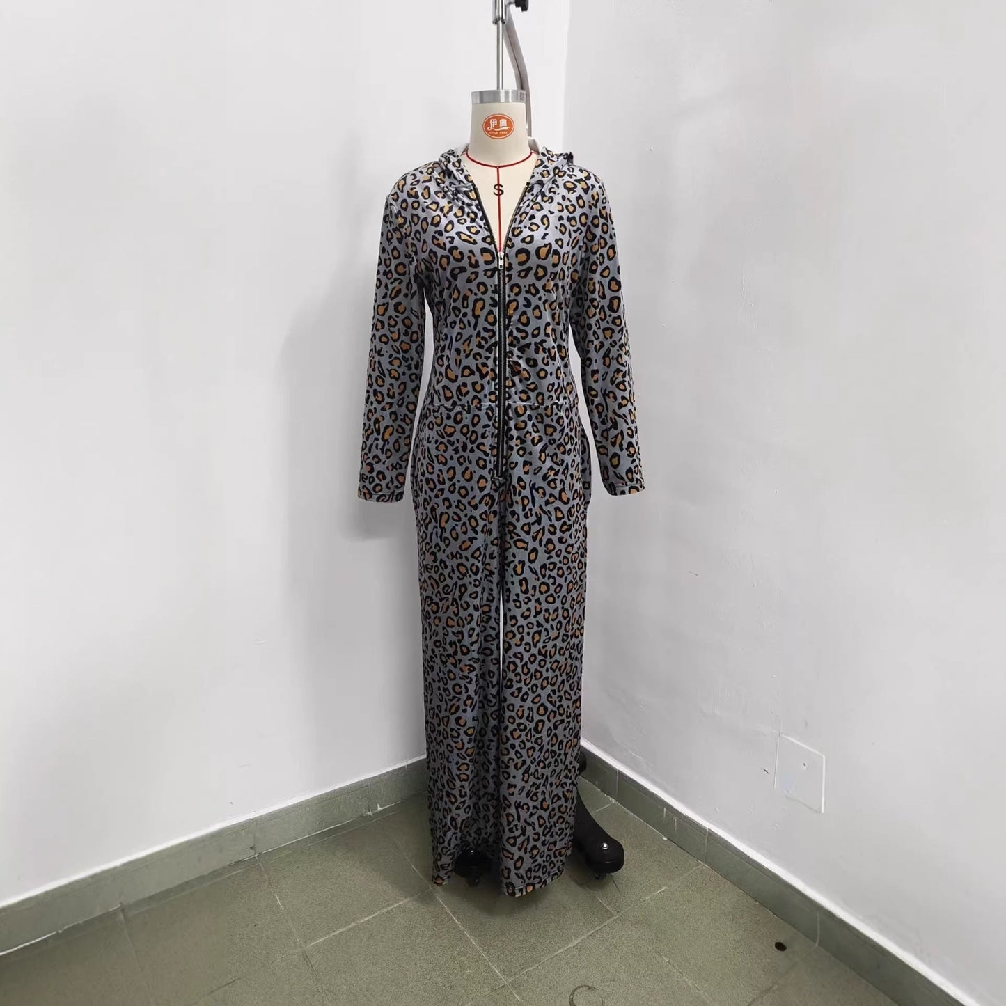 Front view of leopard print hooded jumpsuit on a mannequin