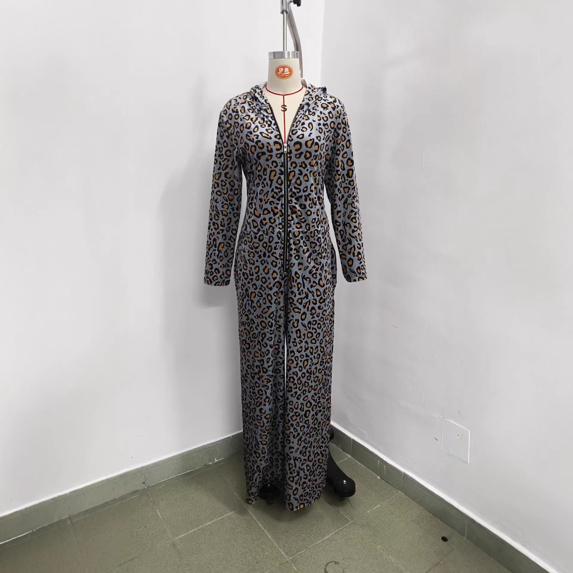 Front view of leopard print hooded jumpsuit on a mannequin