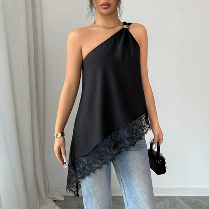 Full-length view of black off-shoulder lace patchwork vest with metal buckle and irregular lace hem holding handbag
