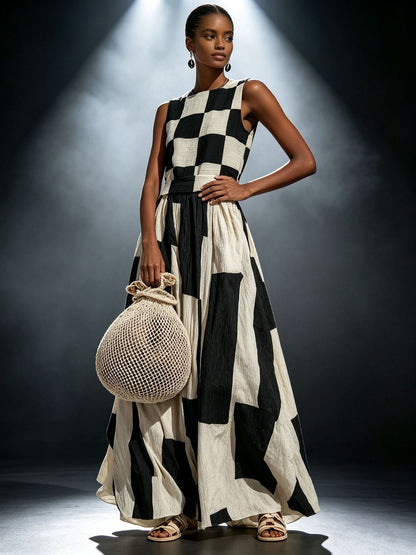 Full-body outdoor view of a model in a light blue floral off-the-shoulder midi dress featuring a tailored bodycon silhouette, asymmetric trumpet hem, white high heels, and a leather handbag.