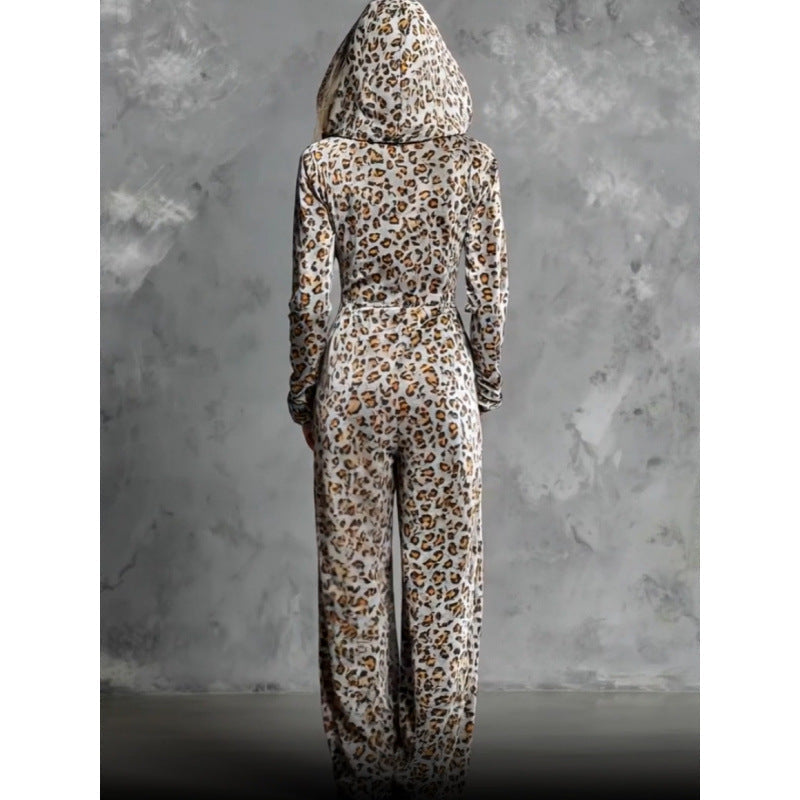 Back view of model wearing full-length hooded leopard print wide leg jumpsuit