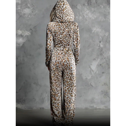 Back view of model wearing full-length hooded leopard print wide leg jumpsuit