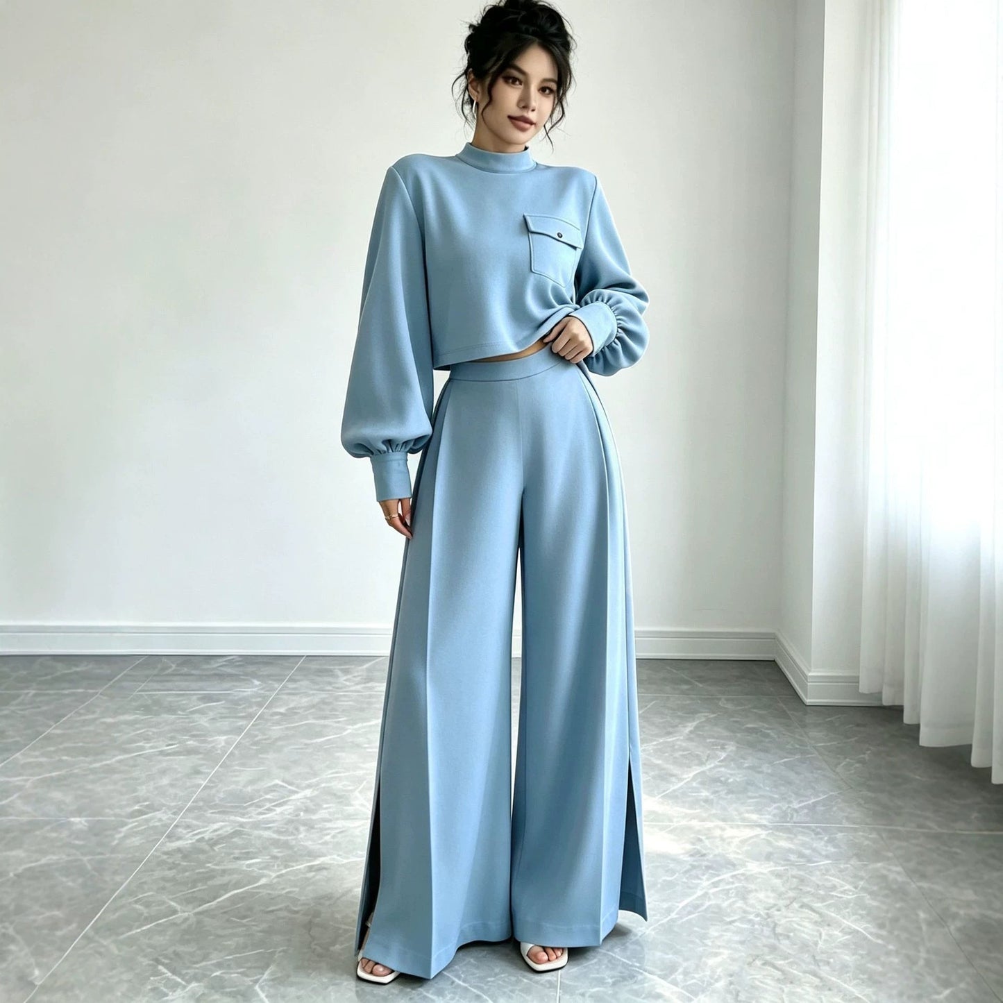 Front perspective of a light blue floral printed dress showcasing the draped crossover collar, structured waistline, and fluid asymmetric ruffle hem.