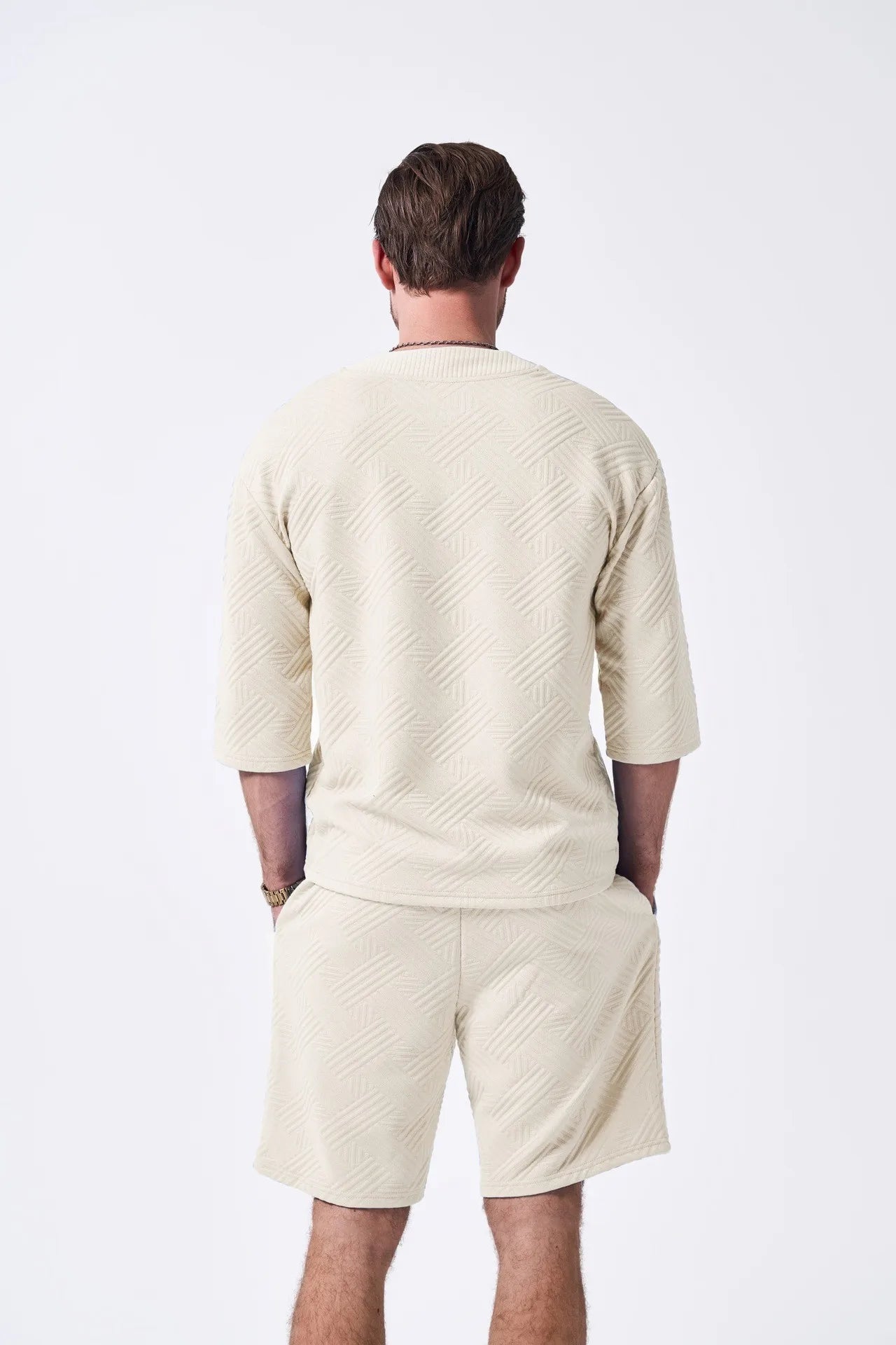 The 2025 new men's summer suit is a casual and versatile solid-color jacquard V-neck short-sleeved T-shirt with two shorts