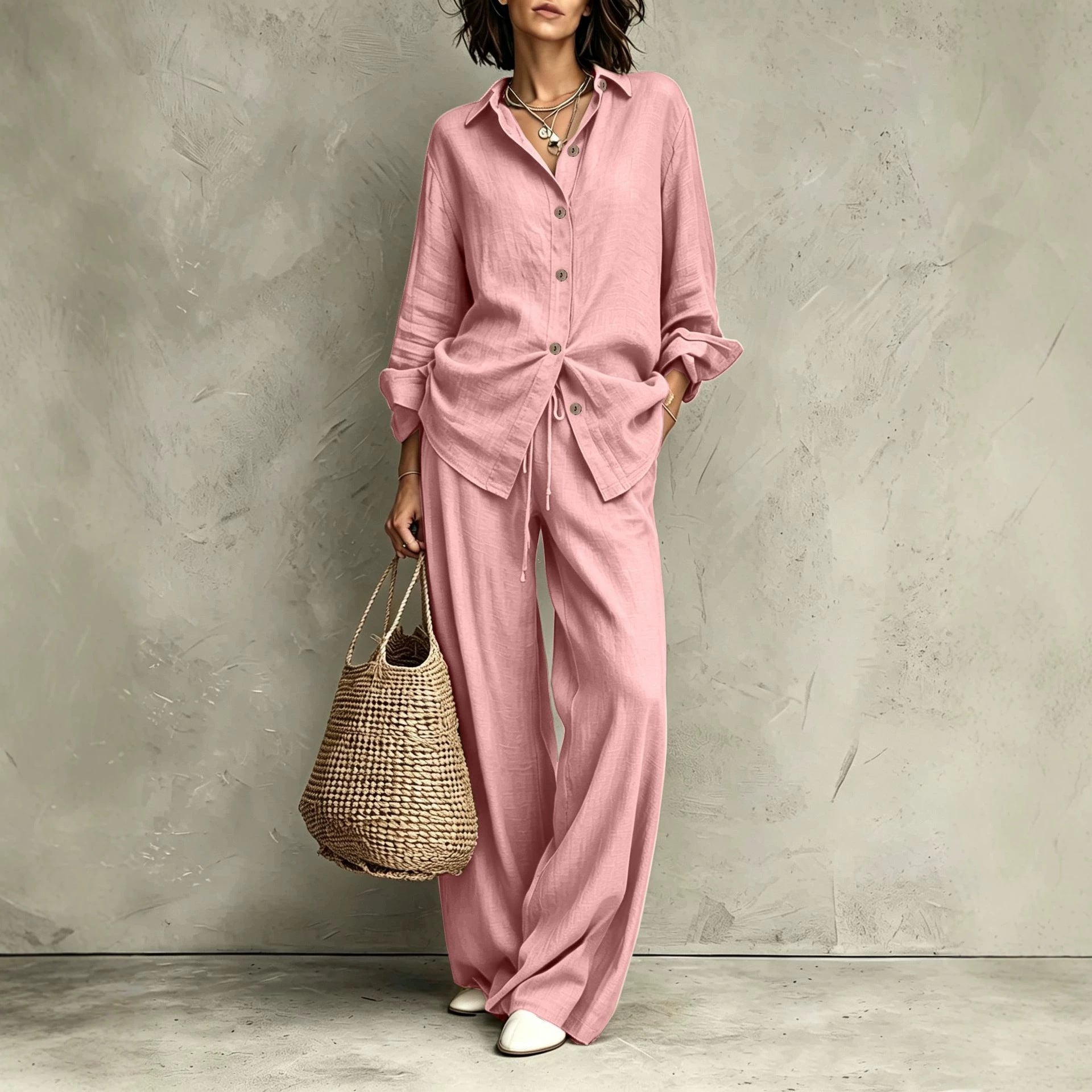 Women's button-down shirt and wide-leg pants set in army green – full outfit front view showing relaxed casual silhouette and straw bag