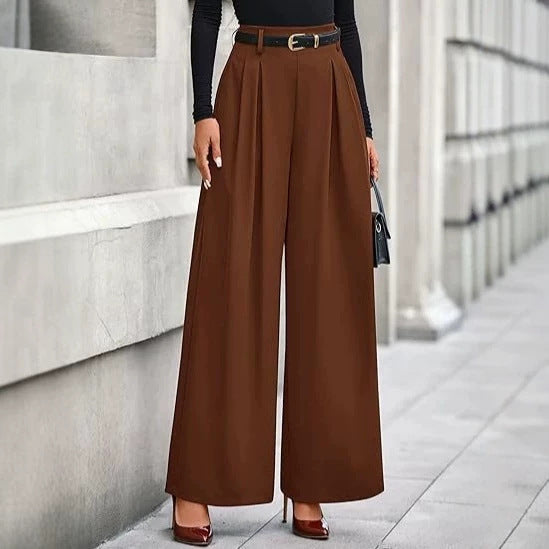 Women's pleated wide-leg trousers in rich brown featuring a slimming drape silhouette, structured front pleats, and a belted adjustable waist
