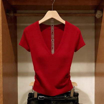 Women's red short-sleeve V-neck ice silk knit top featuring a slim-fit design, ribbed texture, and lightweight finish, hanging in a wooden wardrobe.