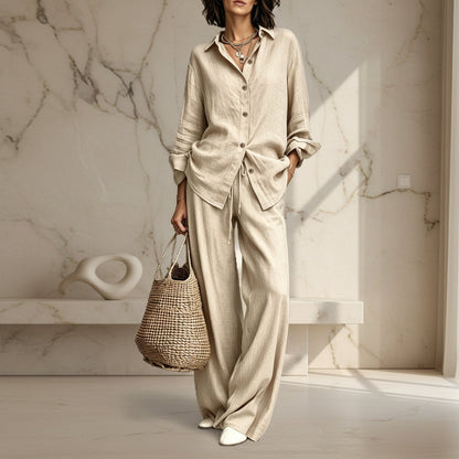 Women's button-down shirt and wide-leg pants set in apricot – full outfit front view showing relaxed casual silhouette and straw bag