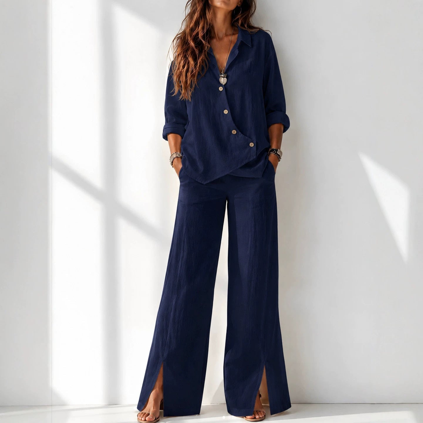 Women's asymmetrical long-sleeve top and wide-leg pants set in navy blue – full outfit front view showing relaxed boho silhouette